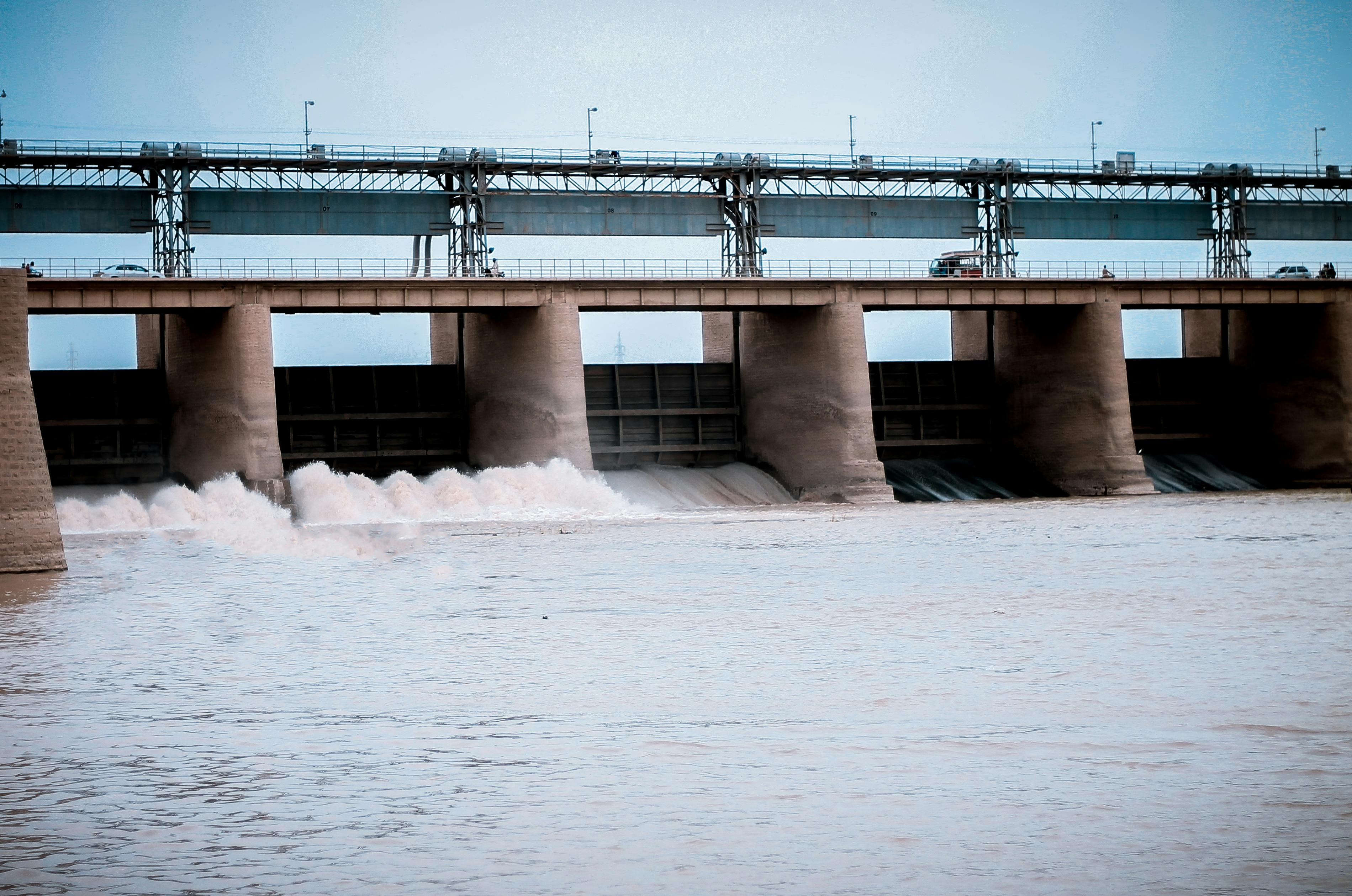 Hydroelectric dam pouring out water from river